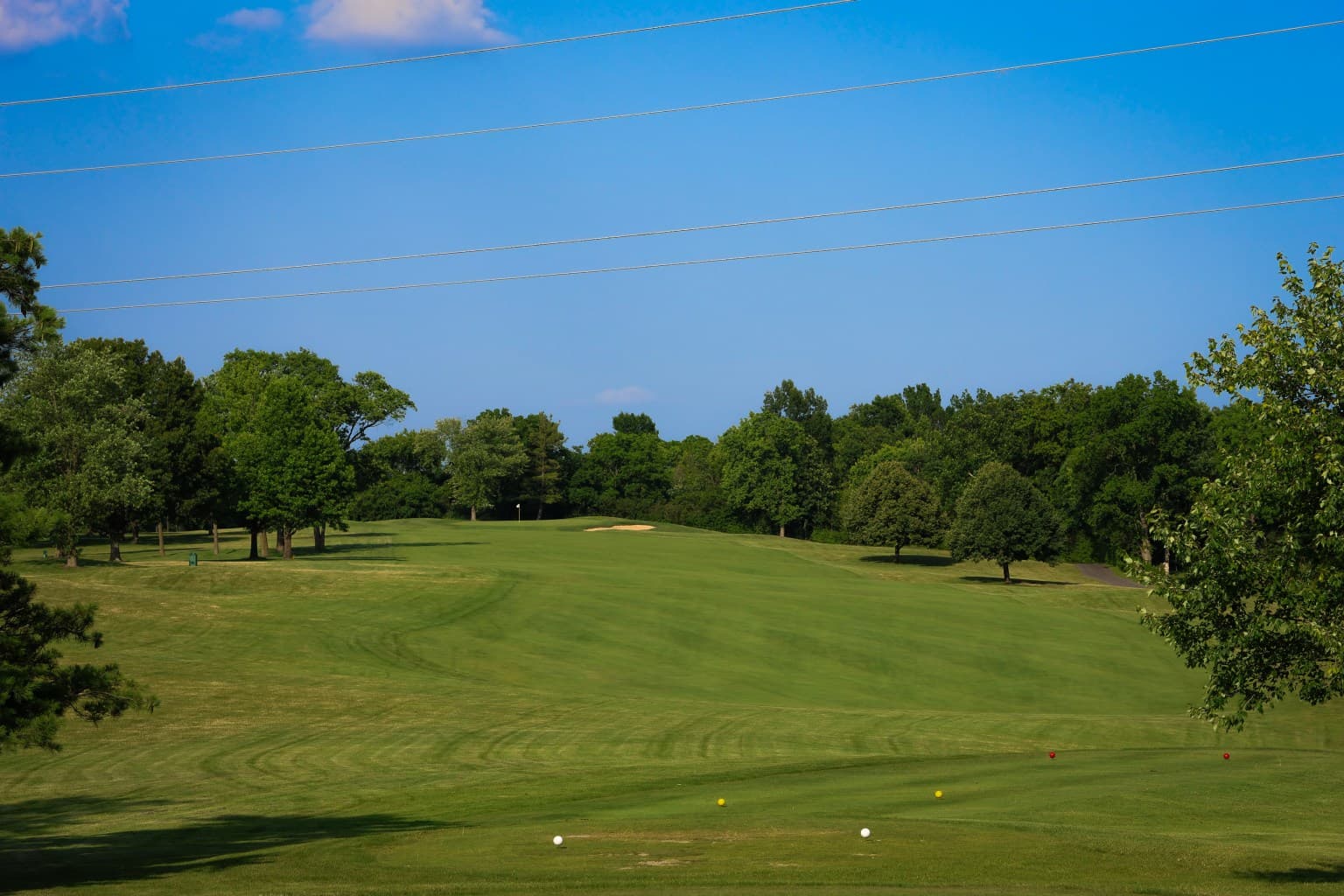 Late afternoon shadows across the green